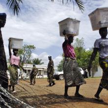 Citizens and UNMIL destroy voting materials in Liberia.